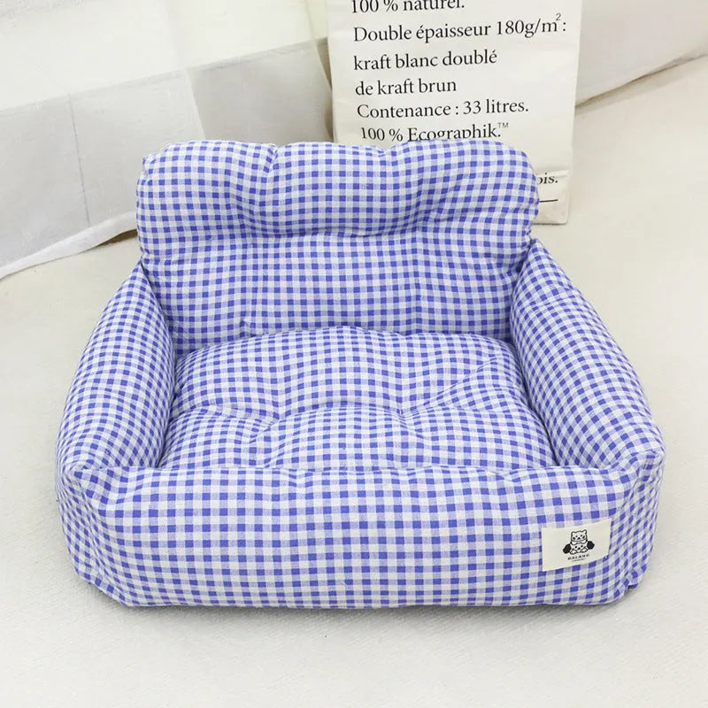Grey and blue plaid cloth dog nest for car travel, shown in small and large sizes.