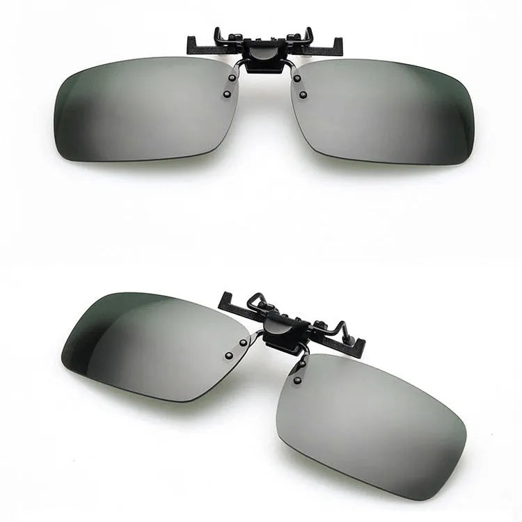 Clip-on night vision polarised sunglasses attached over a pair of prescription glasses for driving.