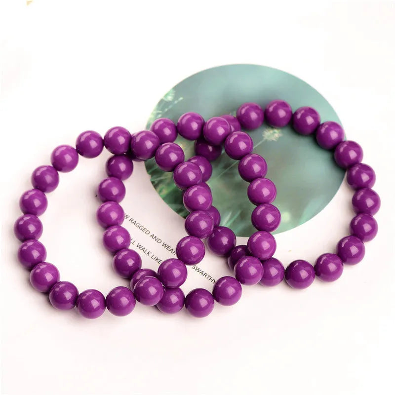 Polished purple mica crystal unisex bracelet in a single ring design on a white background.