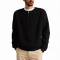 Man wearing a grey half-zip textured knit pullover sweater with a loose fit.