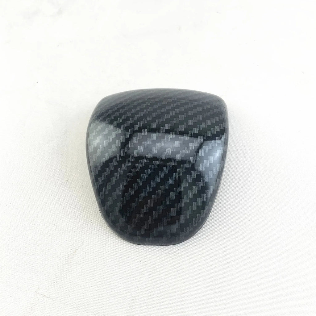 Black carbon fibre pattern gear shift head cover for Smart RunK3 car interior.