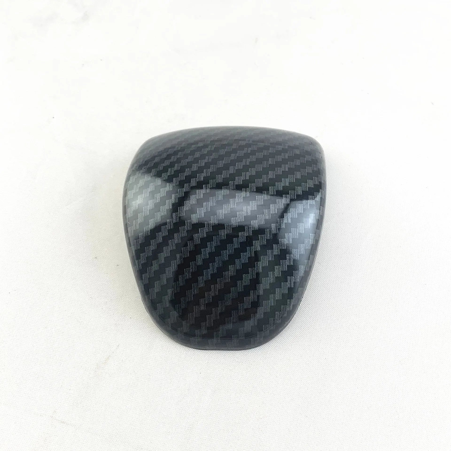 Black carbon fibre pattern gear shift head cover for Smart RunK3 car interior.