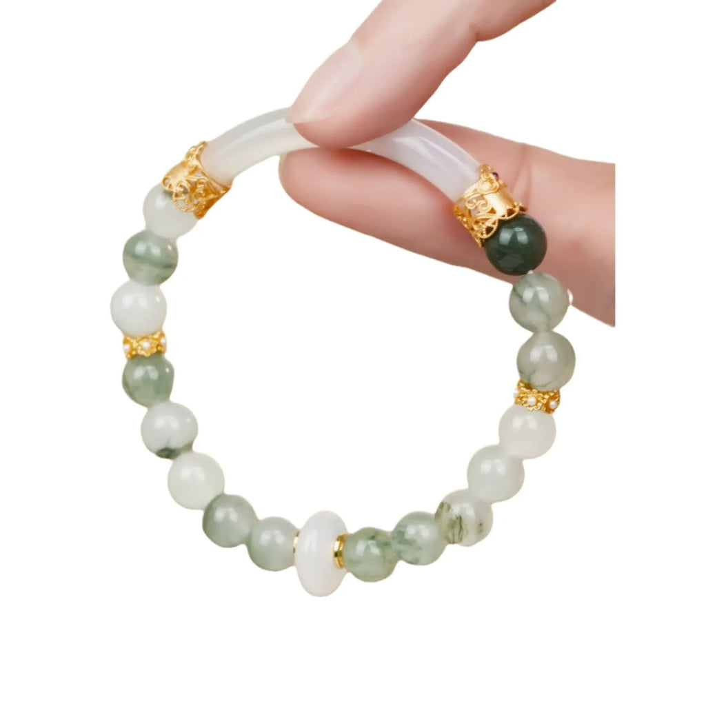 Emerald green Tian Shan Cui stone women's bracelet with floating floral motif and circular pattern