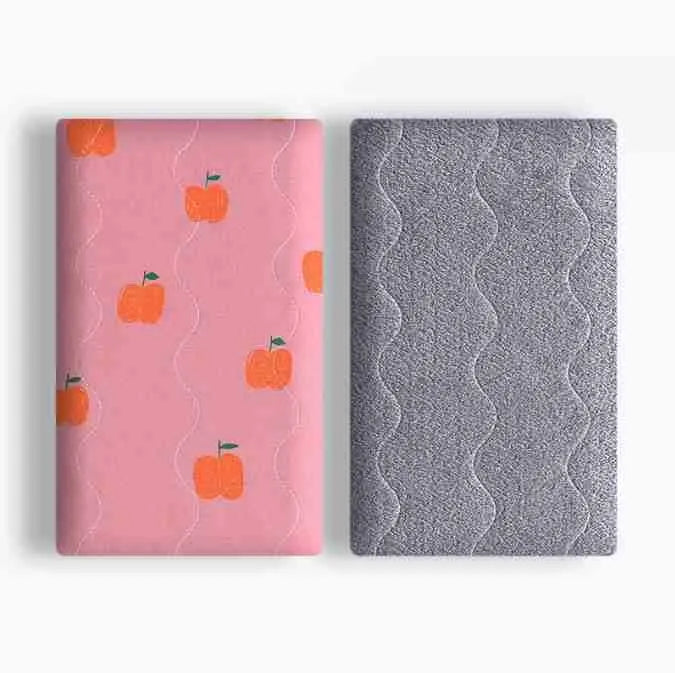 Colourful double-sided cotton wool pet blanket with dinosaur and cartoon bear prints laid flat.