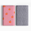 Colourful double-sided cotton wool pet blanket with dinosaur and cartoon bear prints laid flat.