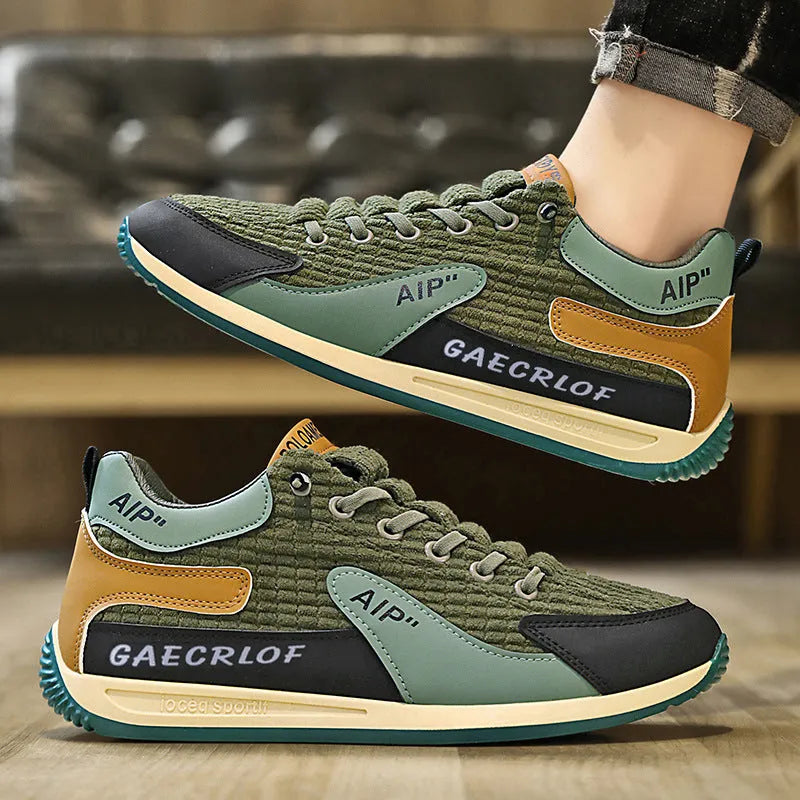 Men's green and grey mesh running shoes with round toe design and front lace-up closure