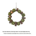 Hamster chew toy with Applewood stick and woven straw ball ring on a white background.