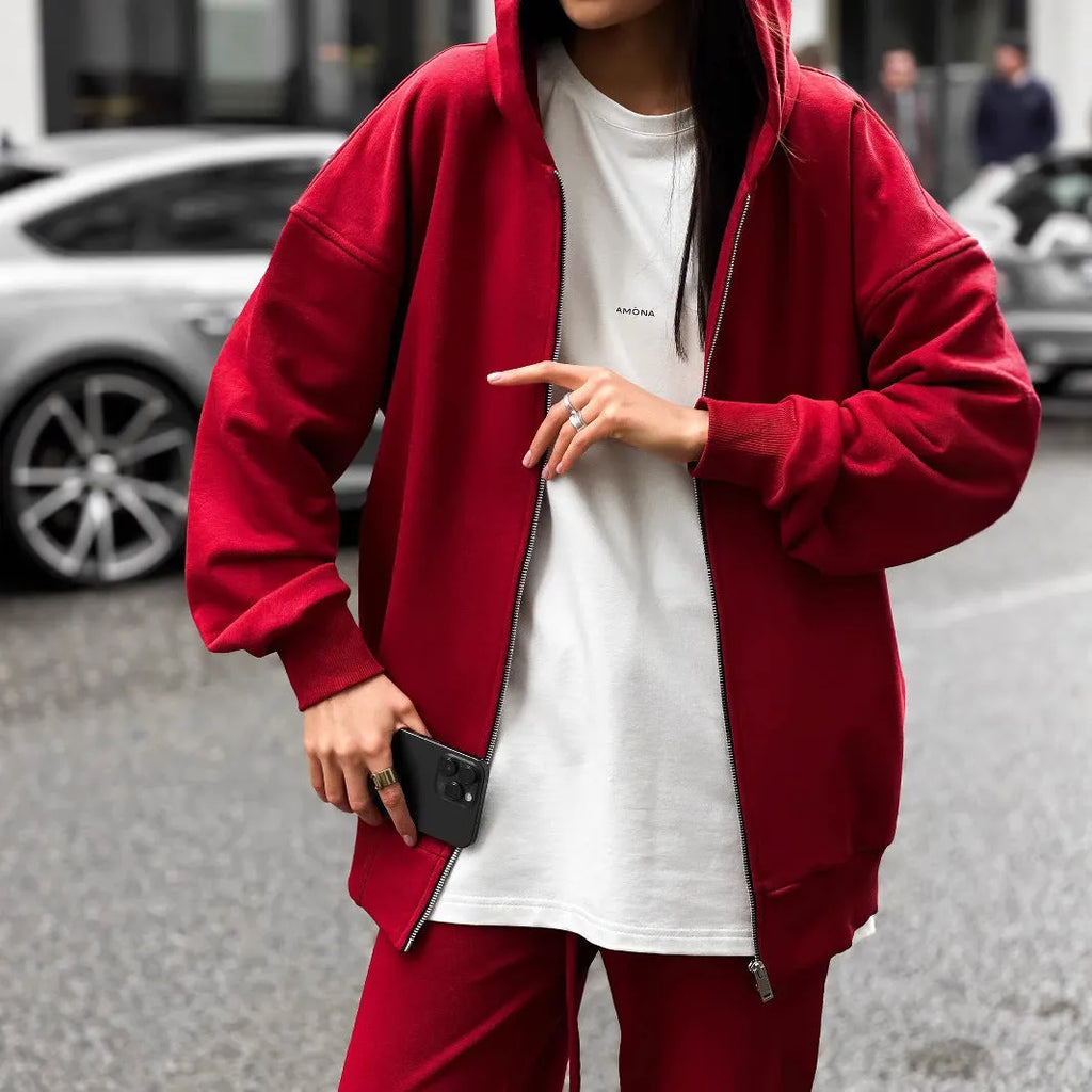 Women's loose fit polyester two-piece set with long-sleeved coat and trousers in a solid colour.