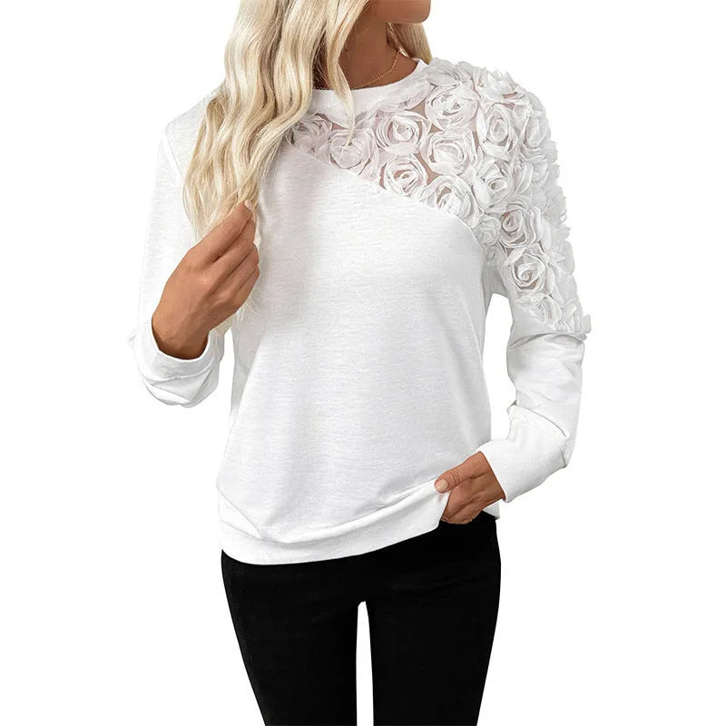 White long sleeve pullover top with floral pattern in loose fit style