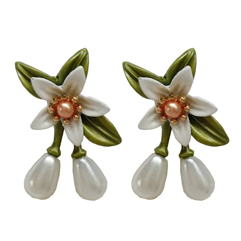 Alloy camellia flower earrings with colour contrast design showing both ear stud and ear clip configurations