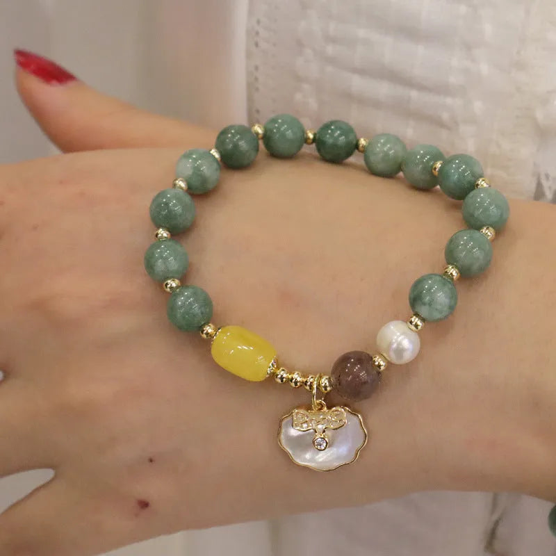 Women's fashion bracelet made from natural green jade shells on a casual background