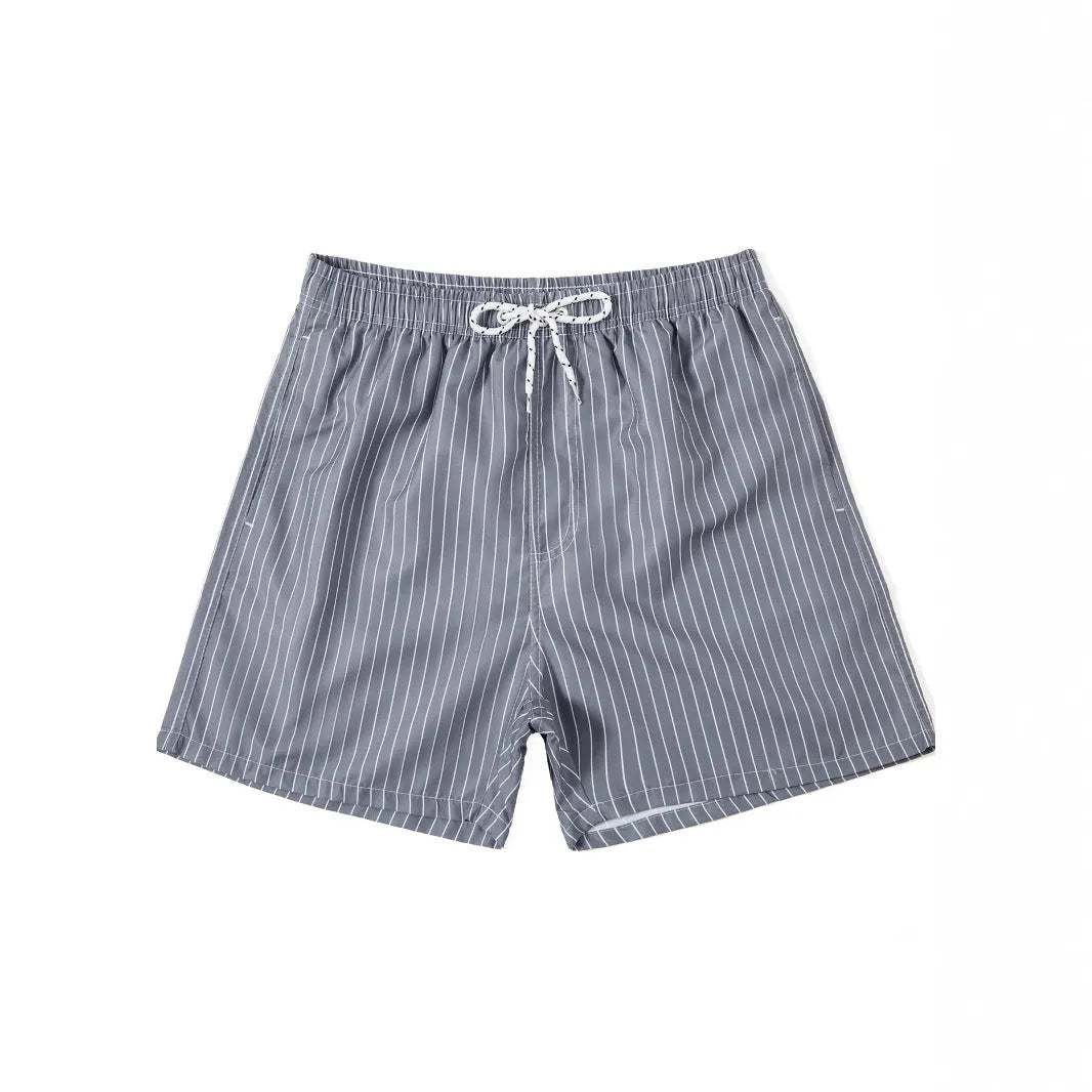 Navy blue striped beach shorts with straight legs on a mannequin.