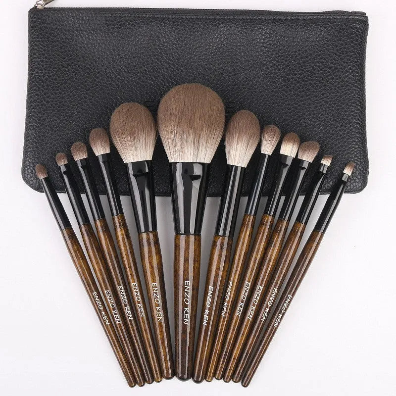 12-piece makeup brush set with wooden handles stored in black PU roll-up case