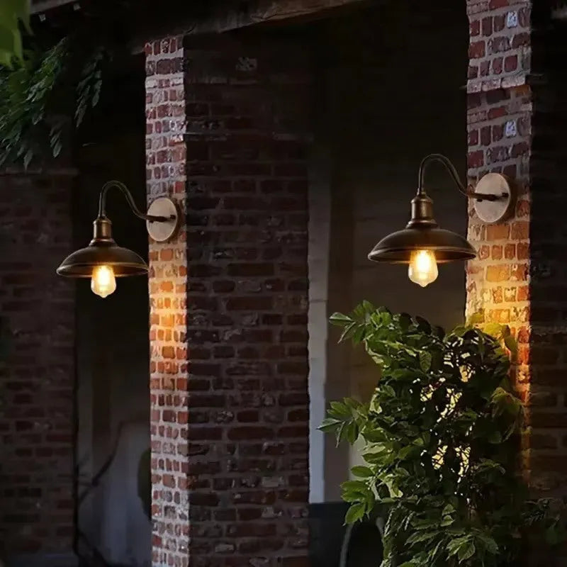 Retro style silver courtyard wall lamp mounted at right angle on villa exterior wall