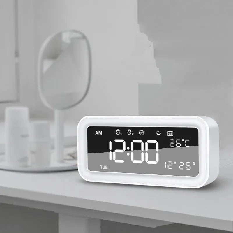 Blue rectangular LED atmosphere light alarm clock with digital display on bedside table