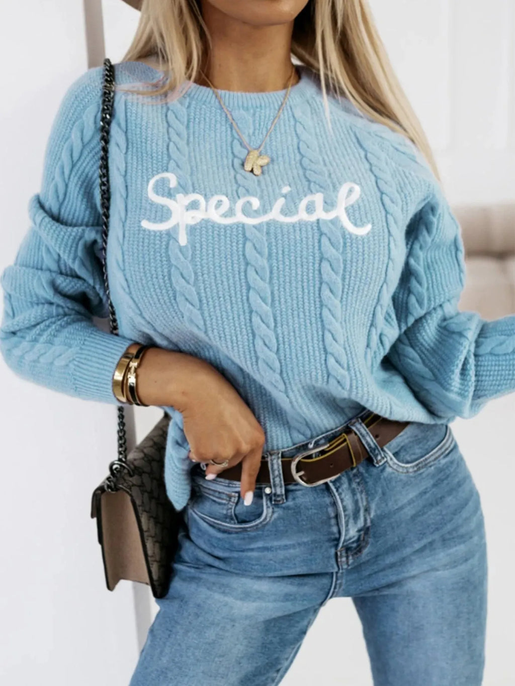 Blue crew neck pullover sweater with embroidered letters pattern in street fashion style
