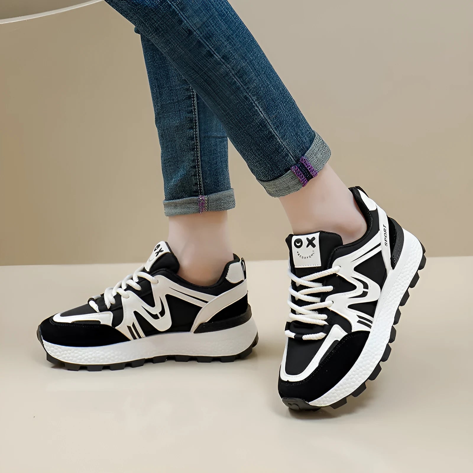 Women's black casual flat shoes with round toe and front lace-up design on a plain background.