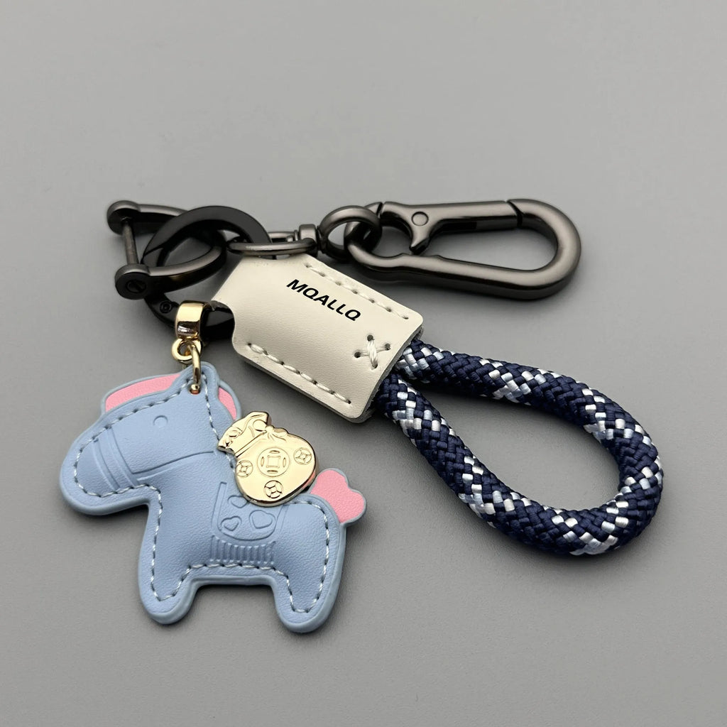 Handmade zinc alloy cowhide car key pendant on a flannel rope strap in various colour options.