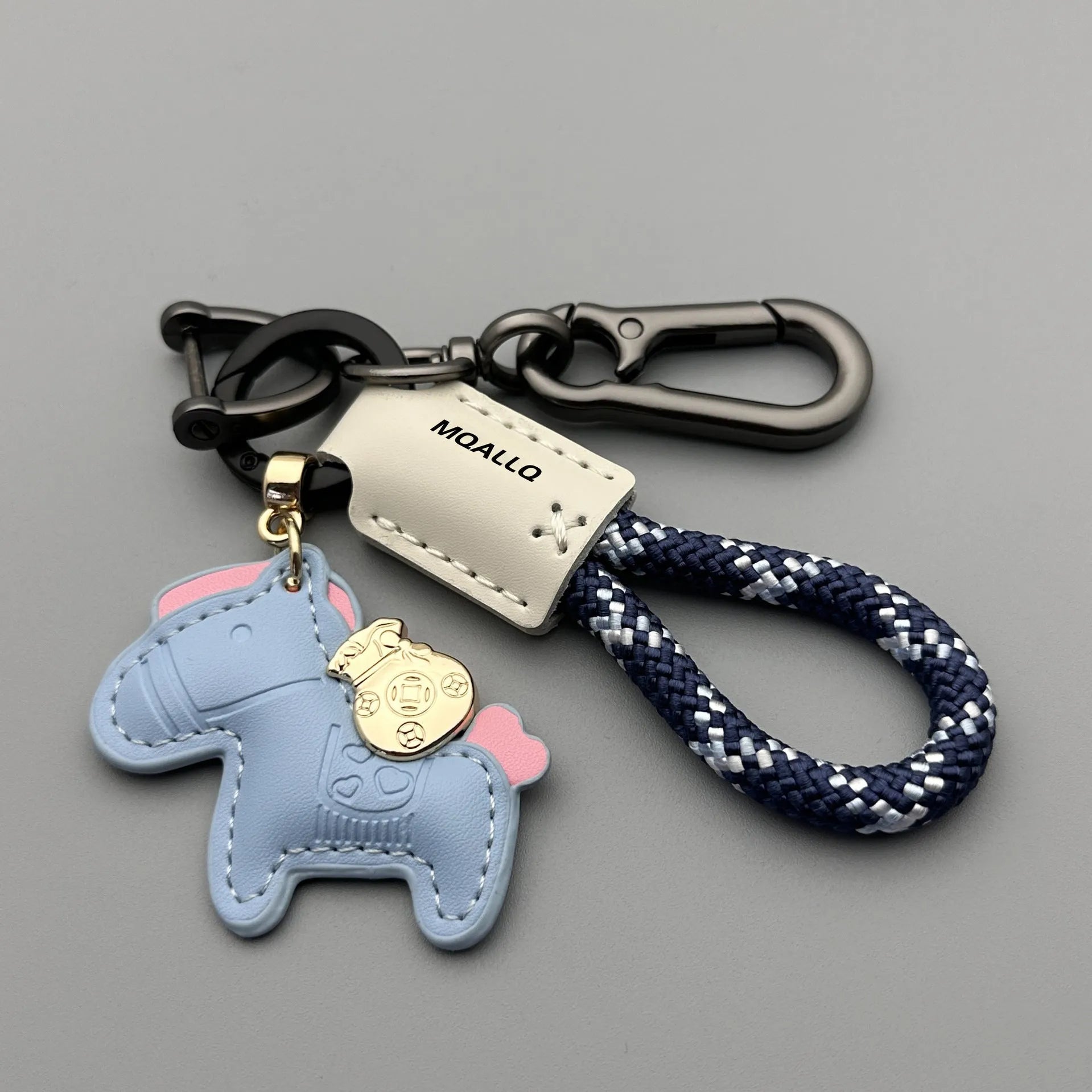 Handmade zinc alloy cowhide car key pendant on a flannel rope strap in various colour options.
