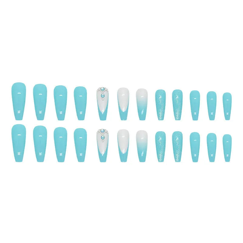 Long ballet false nails with smart blue diamond accents on solid colour background