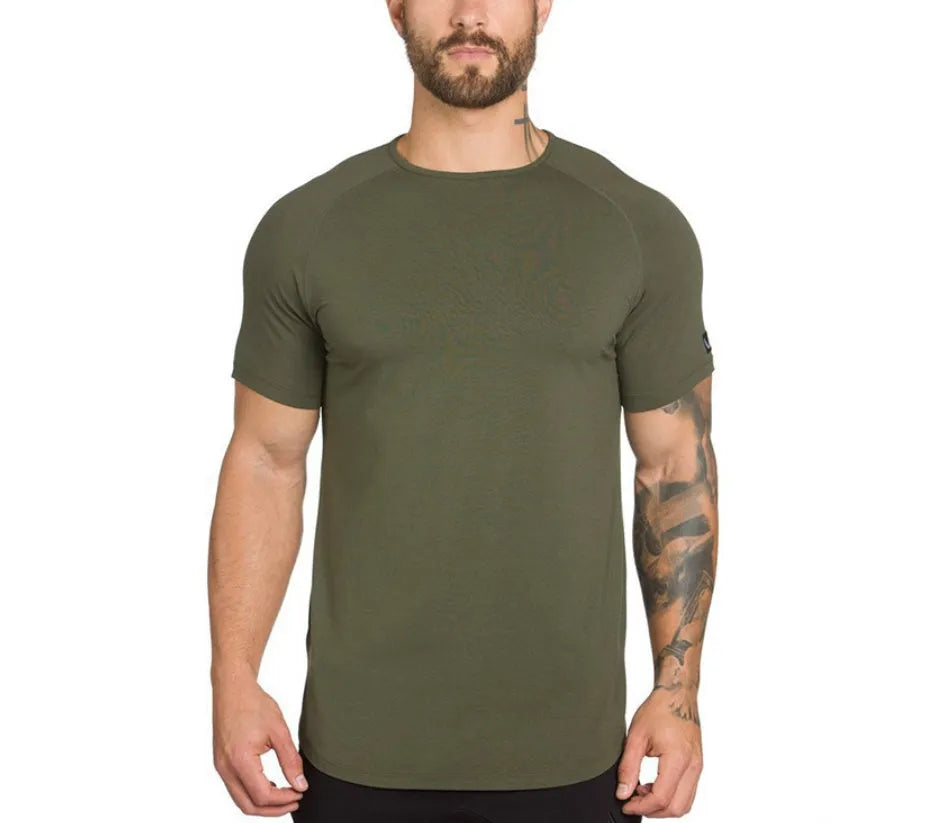 A plain men's grey gym shirt made from cotton and spandex fabric on a hanger.