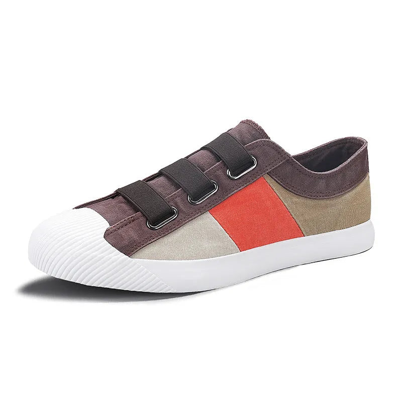 Men's low top canvas sneakers with an elastic band and vulcanised rubber sole in beige colour.