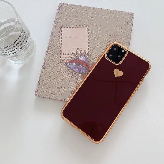 Slim solid colour TPU back cover case for iPhone on a table.