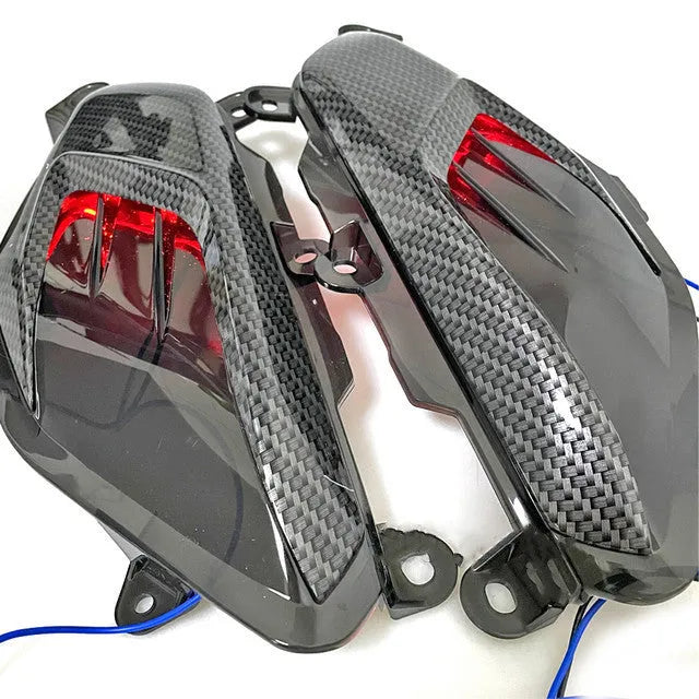 Pair of carbon fibre style LED side lamps for YAMAHA NMAX scooters in blue or red.