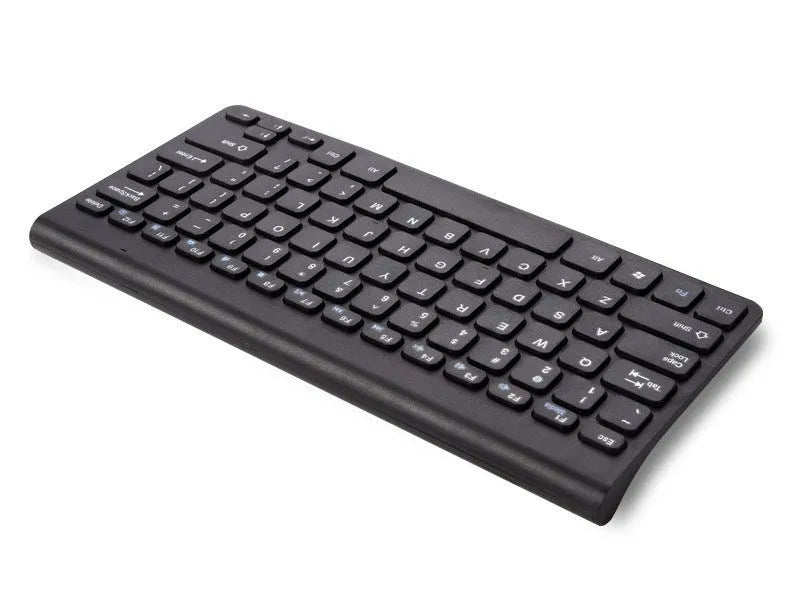 Black and white wireless keyboard and mouse set on a wooden desk