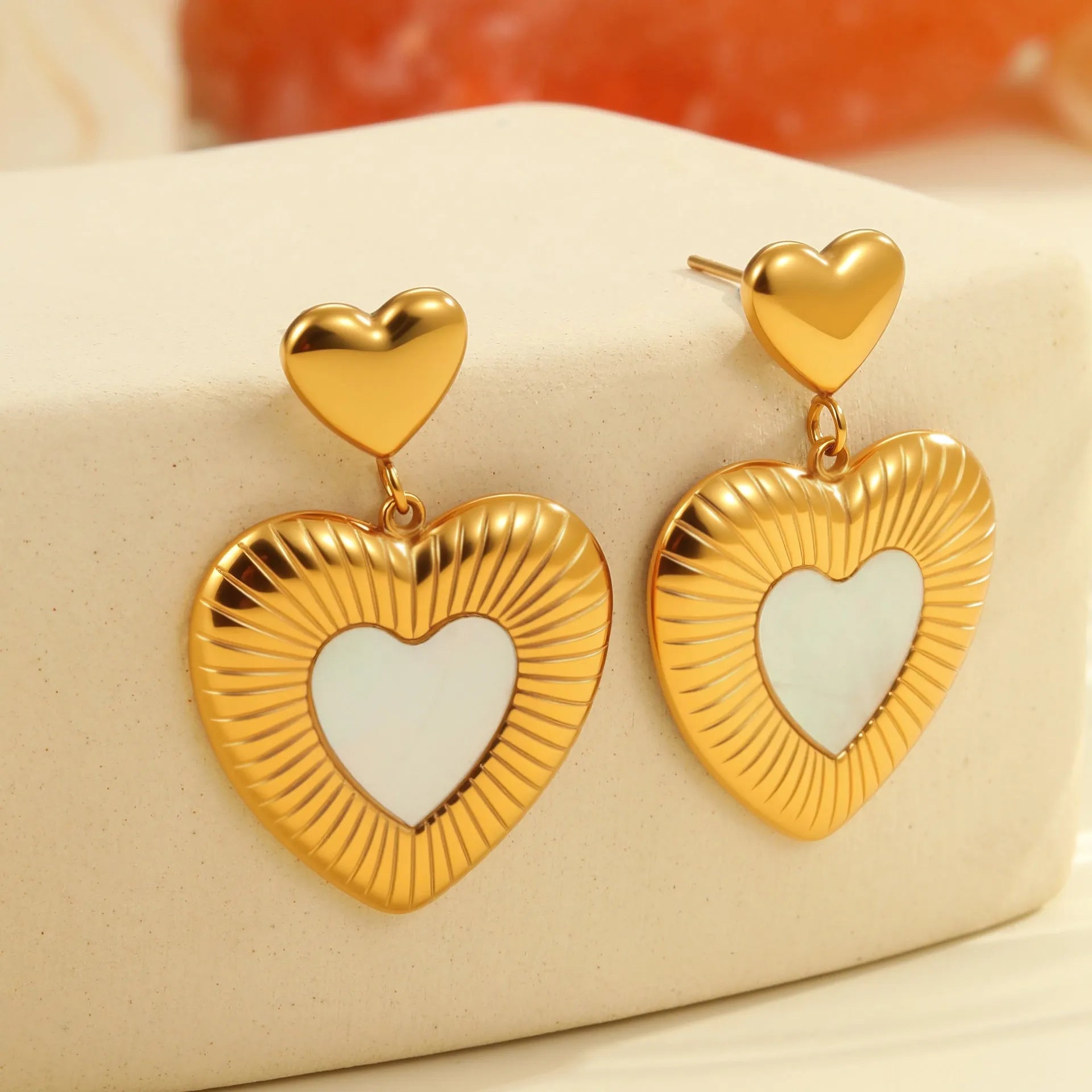 Heart shaped stainless steel earrings with white fritillary pattern and 18K gold electroplated finish for women