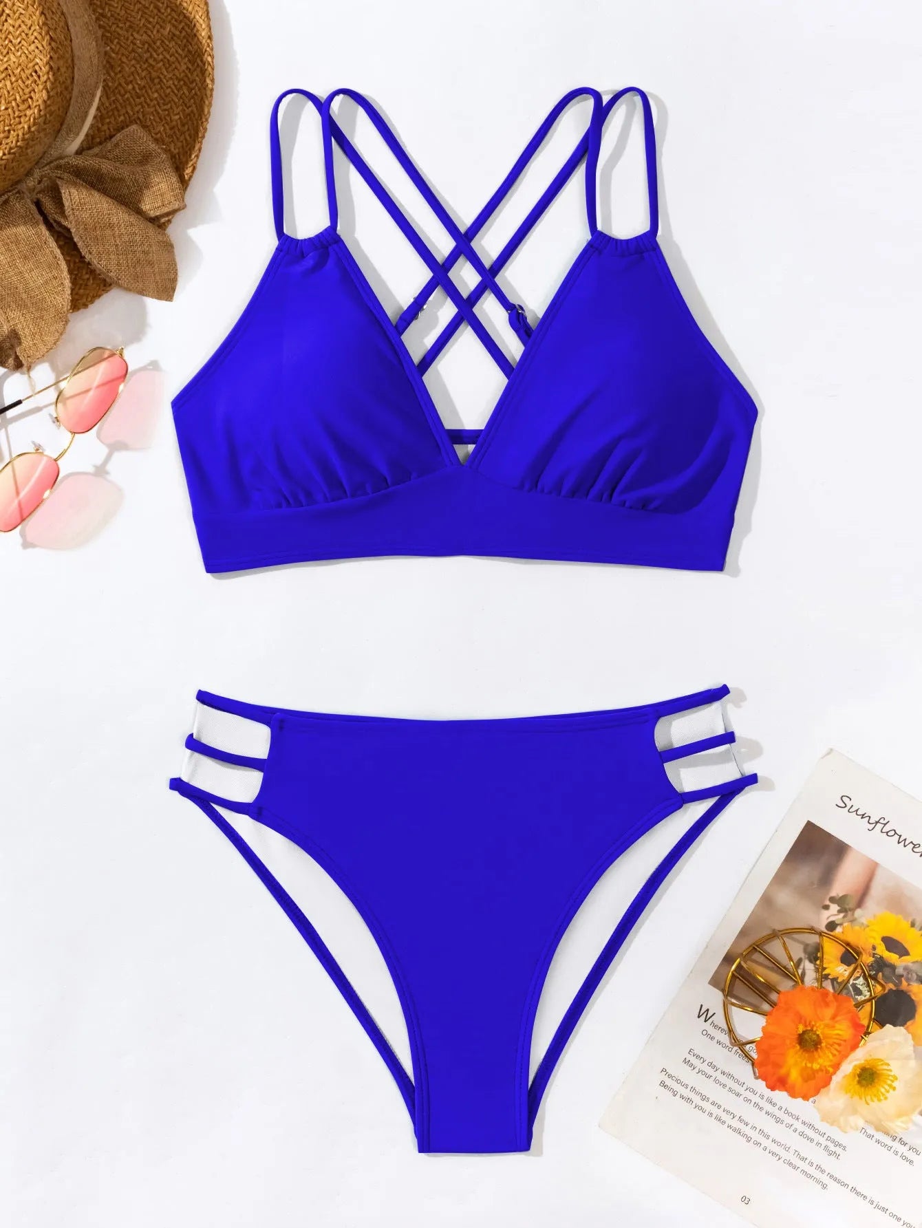 Women's black halter V-neck bikini top and matching split-style swim shorts.