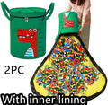 Green felt cube storage bag open as play mat with toys inside and pull rope visible