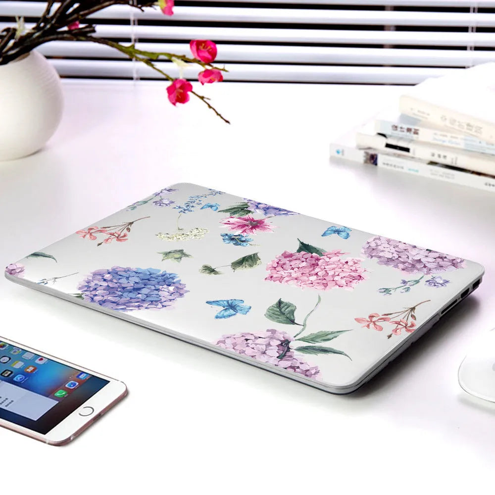 Plastic laptop protective shell with floral pattern for Apple MacBook Air and Pro models.