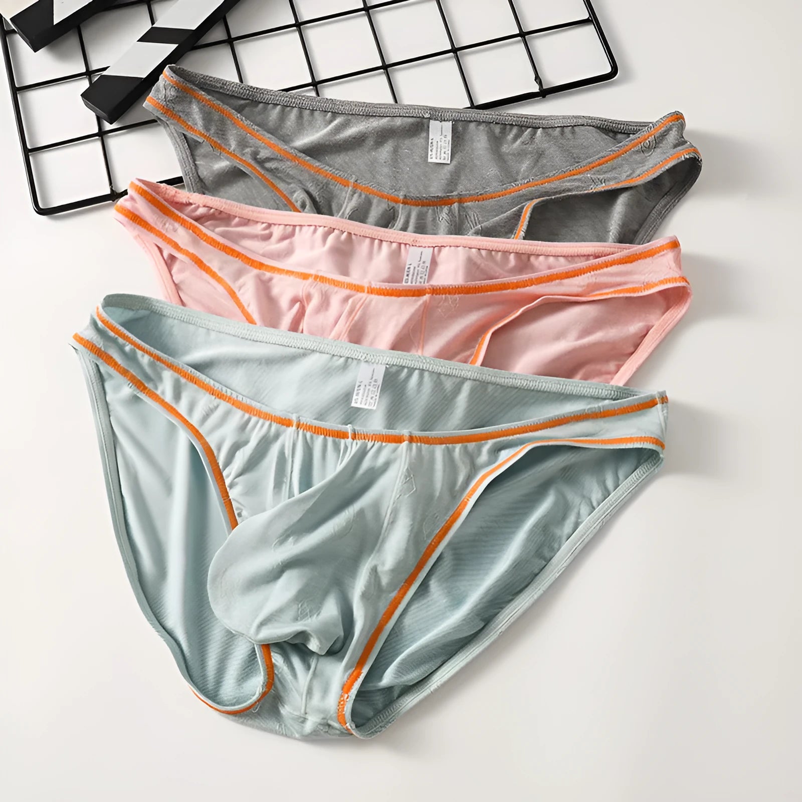 Men's modal hip lift underwear in knitted ice silk fabric showing colour options