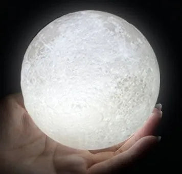 3D printed moon lamp with lunar surface detail on wooden stand, showing touch metal ring at base