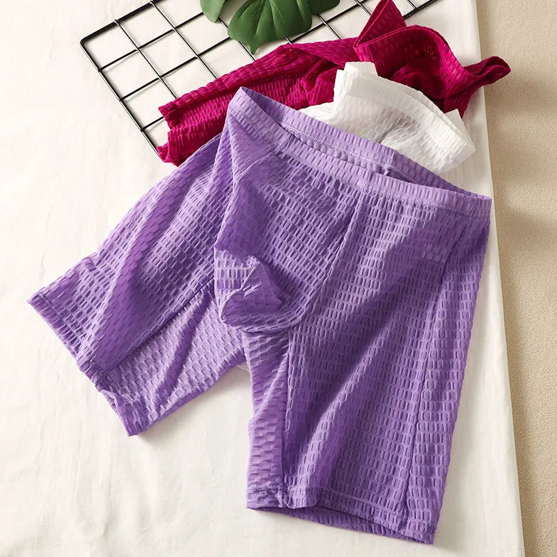 Men's solid colour lace boxer shorts with a lengthened hip-lifting design for shaping.
