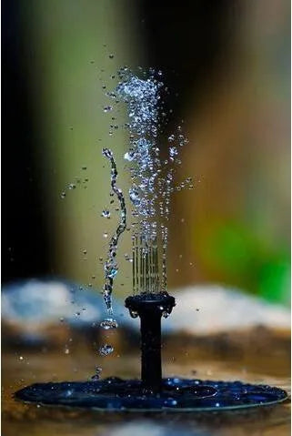 Black solar-powered floating fountain pump with four different nozzles on a 16cm square base.
