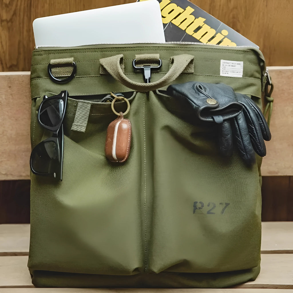 Canvas messenger crossbody bag in charcoal black with shoulder strap and hard handle