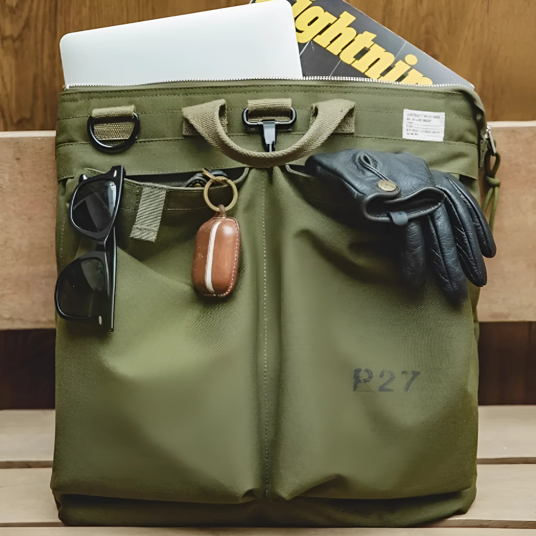 Canvas messenger crossbody bag in charcoal black with shoulder strap and hard handle