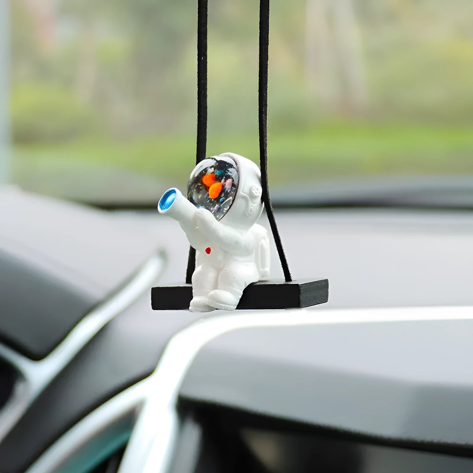 Resin astronaut car pendant showing five cartoon astronaut designs for vehicle decoration