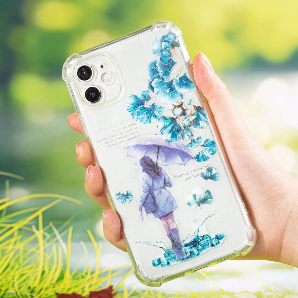 Roll of nature-themed decorative stickers showing ginkgo leaves, maple leaves, and blue fallen leaves designs