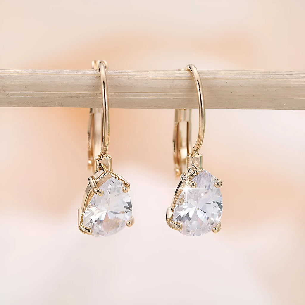 Drop-shaped copper fashion earrings with gemstone inlays in gold or platinum colour finishes