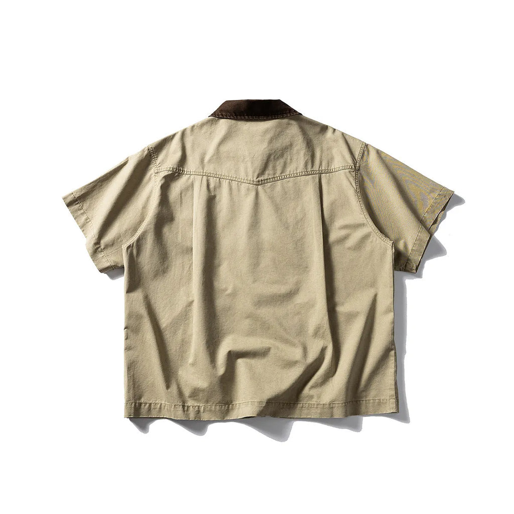 Short sleeve washed cotton overalls shirt in loose cardigan style, khaki colour, on hanger
