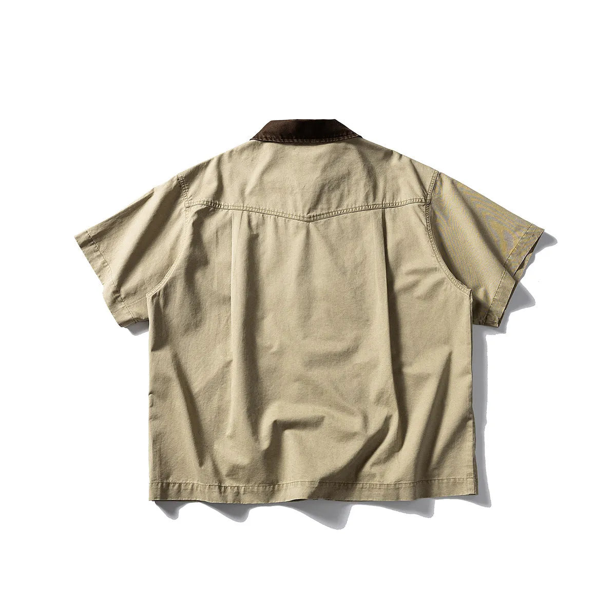 Short sleeve washed cotton overalls shirt in loose cardigan style, khaki colour, on hanger