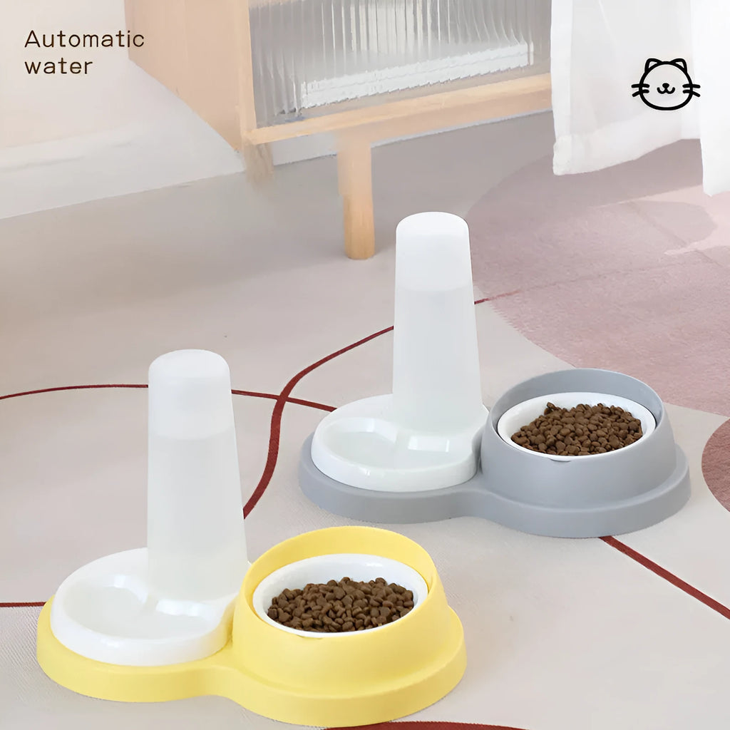 Grey and yellow dual ceramic pet feeding bowl with stainless steel insert and non-slip base.