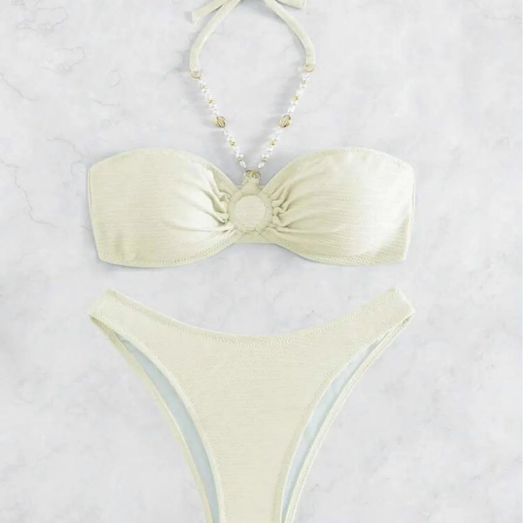 Women's halter neck bikini set in solid colour with brief bottoms for beach swimming