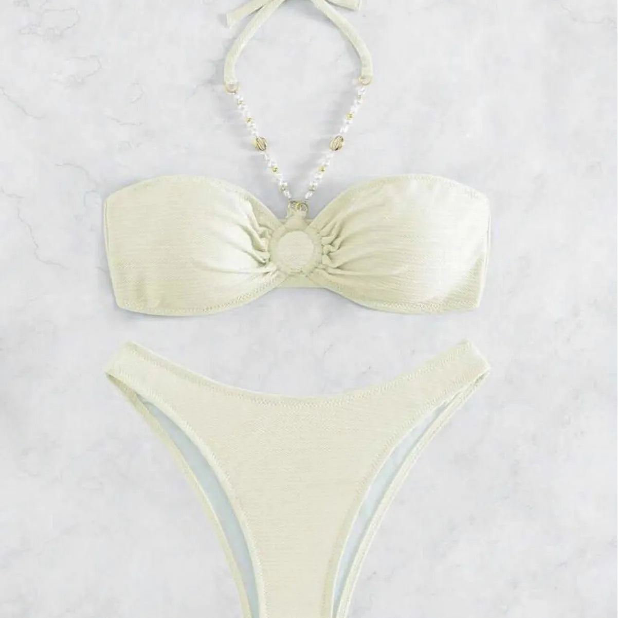Women's halter neck bikini set in solid colour with brief bottoms for beach swimming