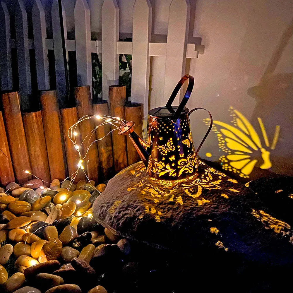 Solar garden lamp with butterfly pattern design and iron construction for outdoor lighting
