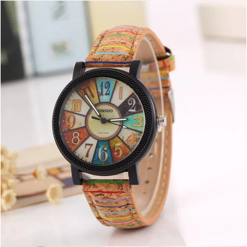 Women's vintage-style quartz watch with brown leather strap and round silver dial