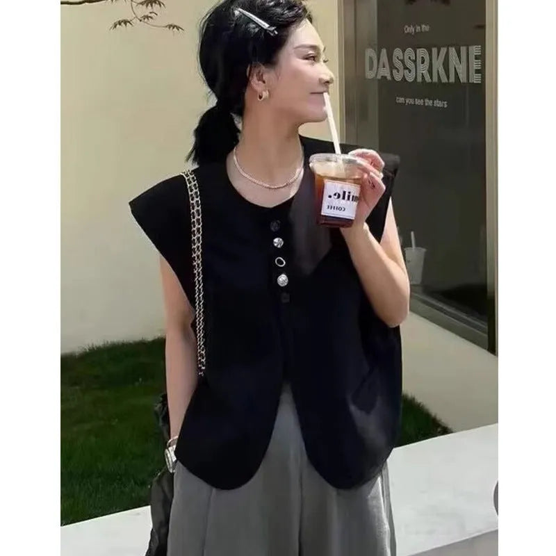 Women's loose fit polyester vest in milky white colour with pockets, shown on hanger